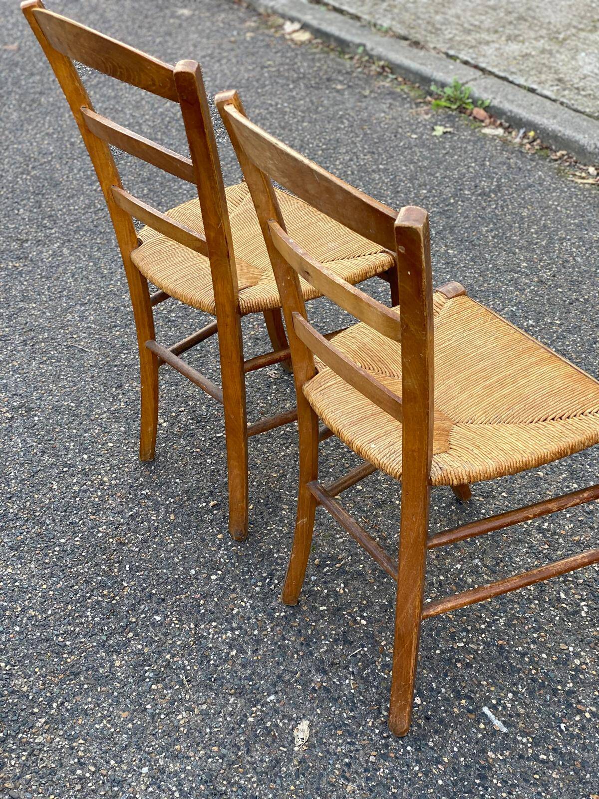 2 solid wood and straw dining chairs