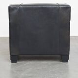 Very comfortable black Art Deco design armchair, made of sheepskin leather