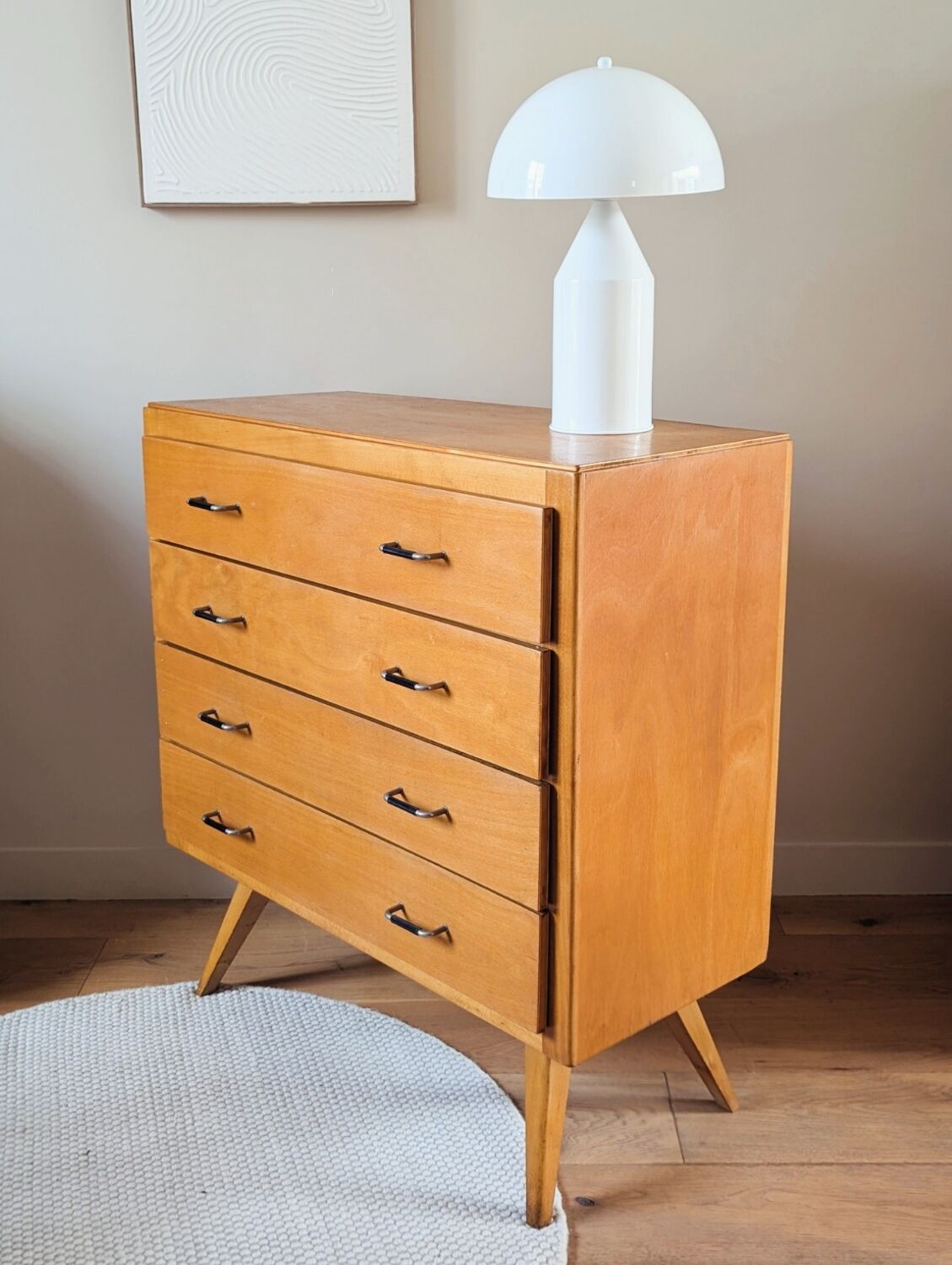 Vintage chest of drawers with tapered legs from the 1960s.