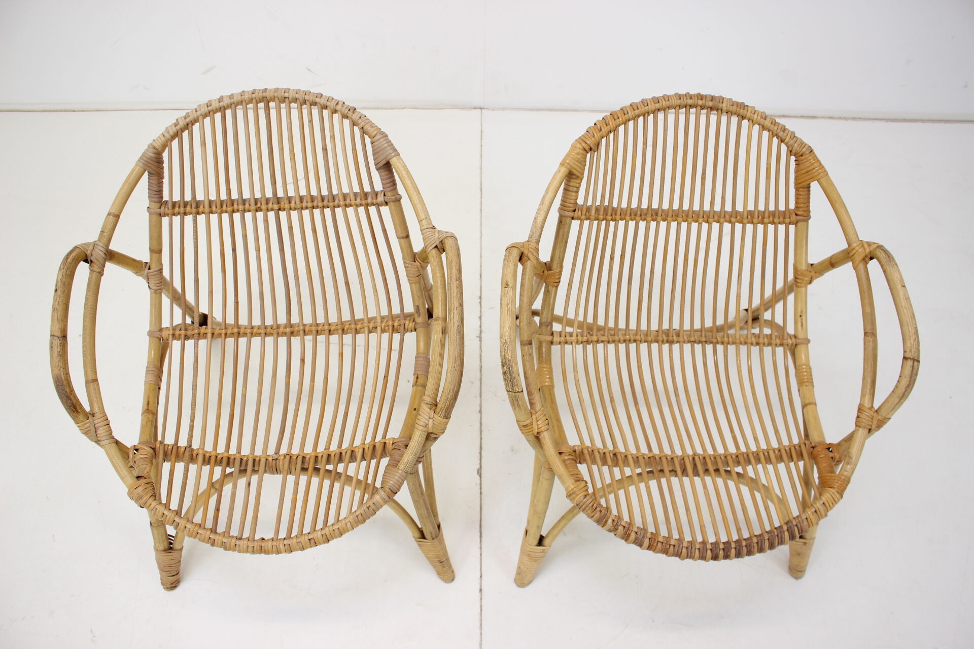 Pair of Alan Fuchs rattan lounge chairs, Czechoslovakia, 1960s