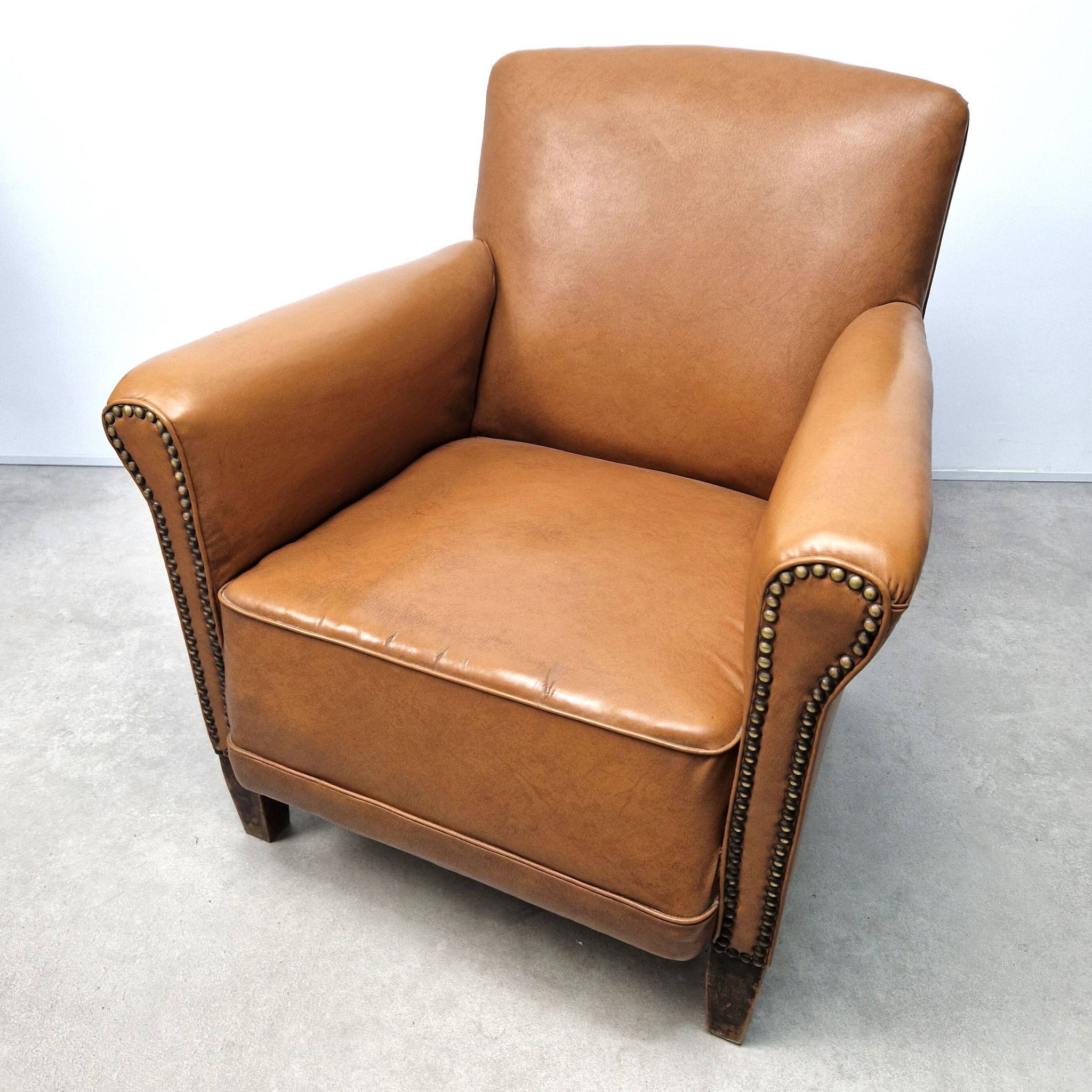 50s club chair in imitation leather and wood