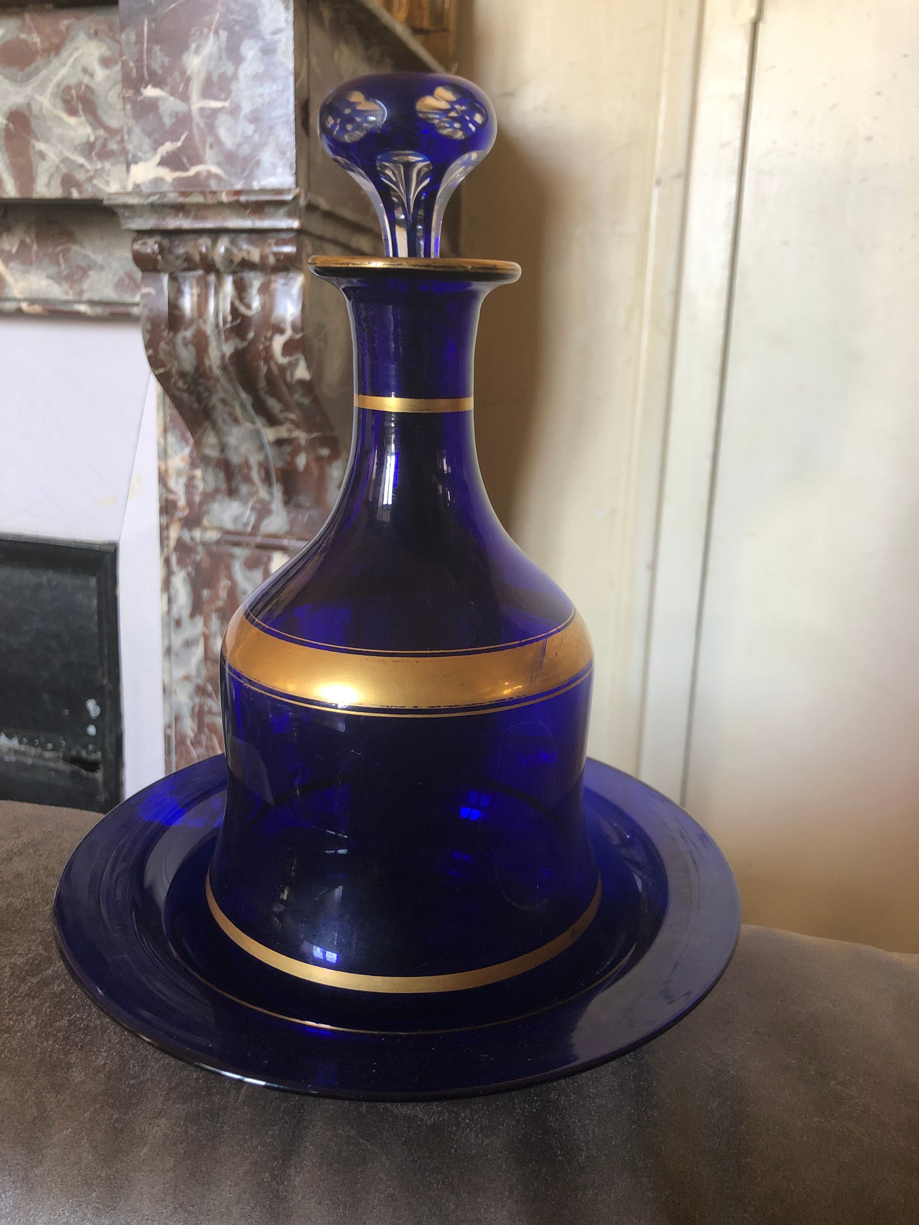 Night carafe and its blue glass saucer