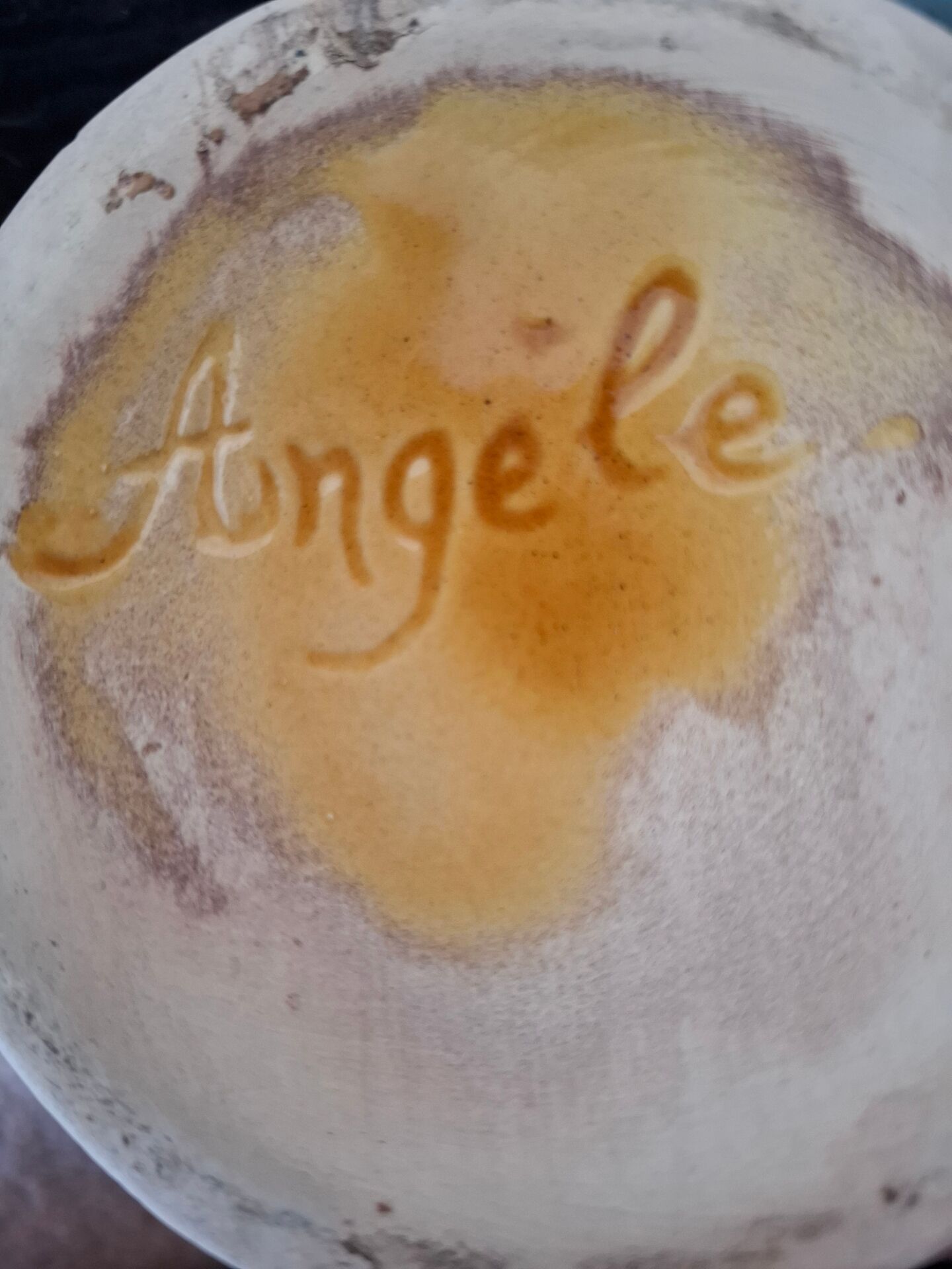 Old ceramic pitcher signed Angèle