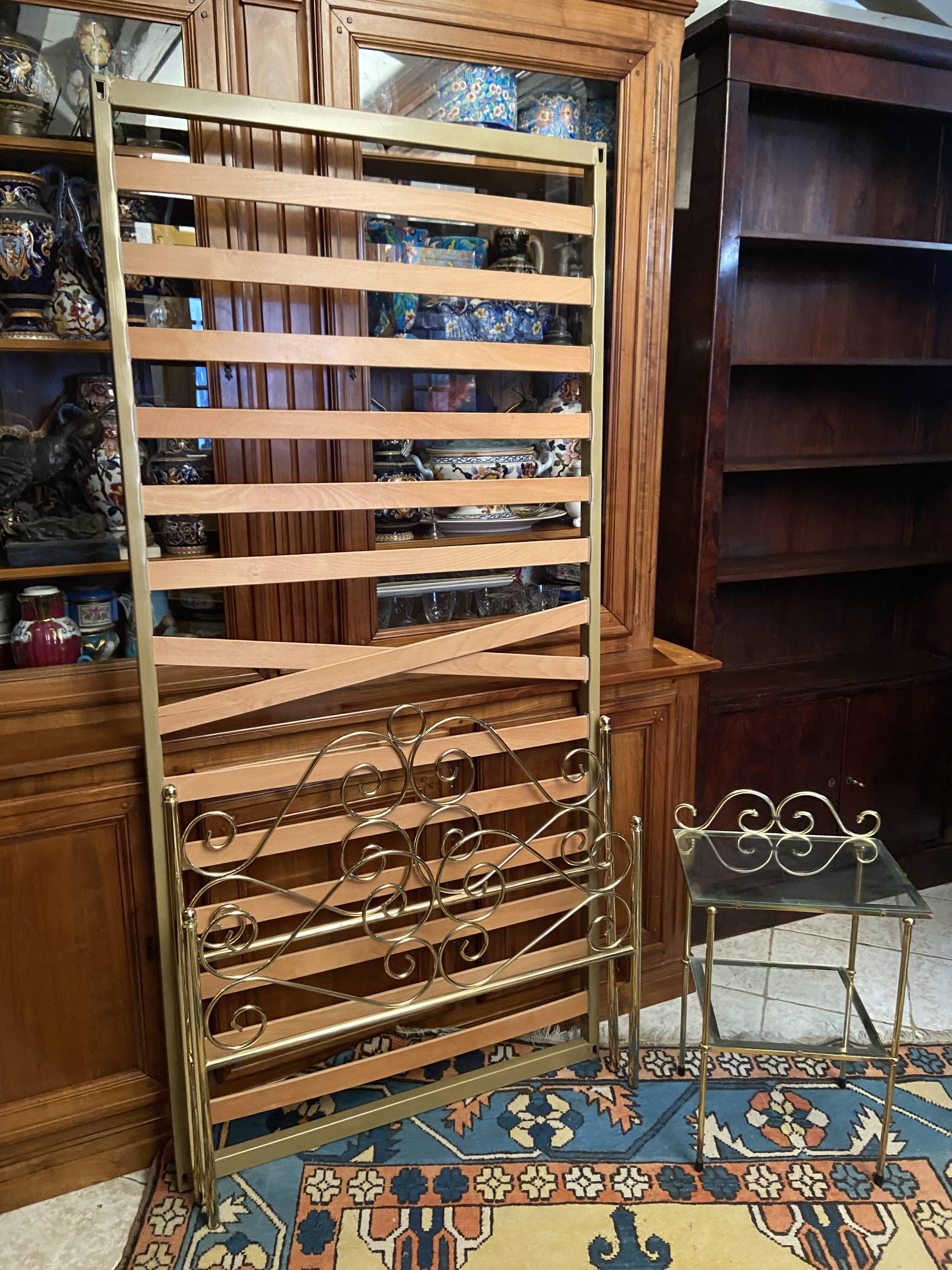 Romantic style single bed in brass with bedside table