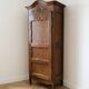 Antique bonnetière wardrobe in carved wood, Classic style.