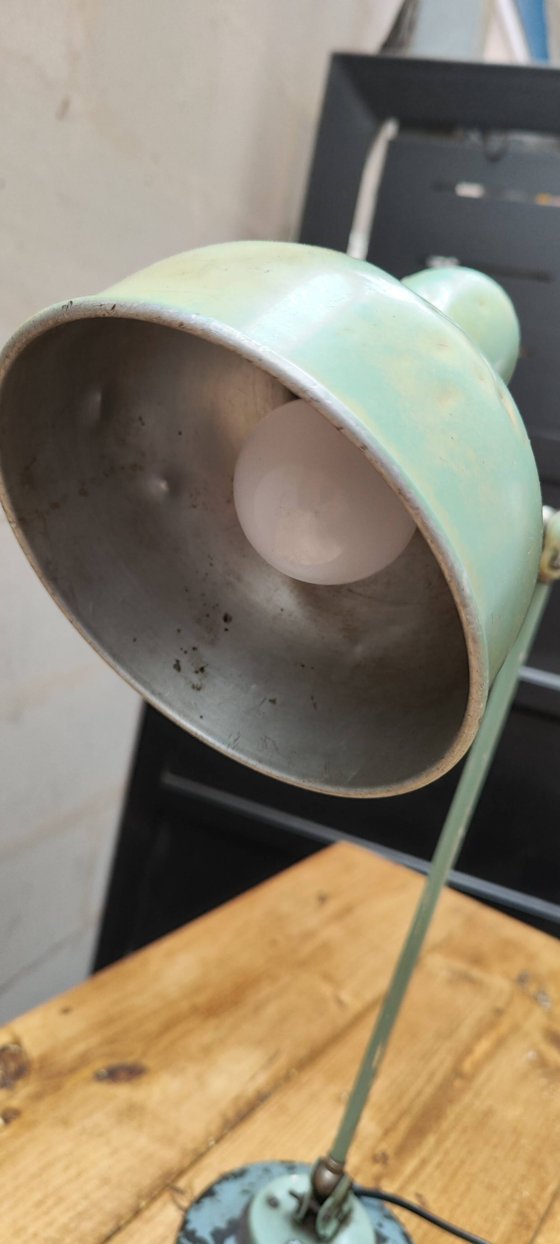 Old green industrial desk lamp