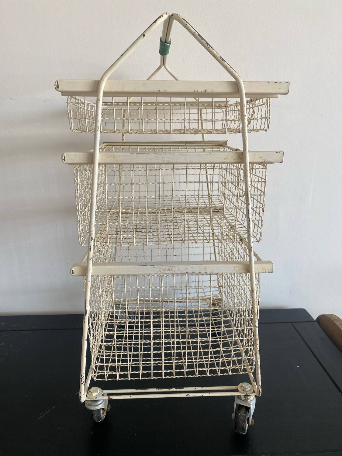 Metal serving trolley on wheels