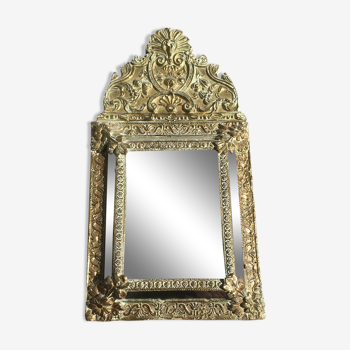 Mirror with antique parecloses
