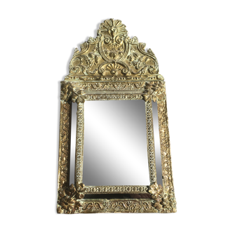 Mirror with antique parecloses