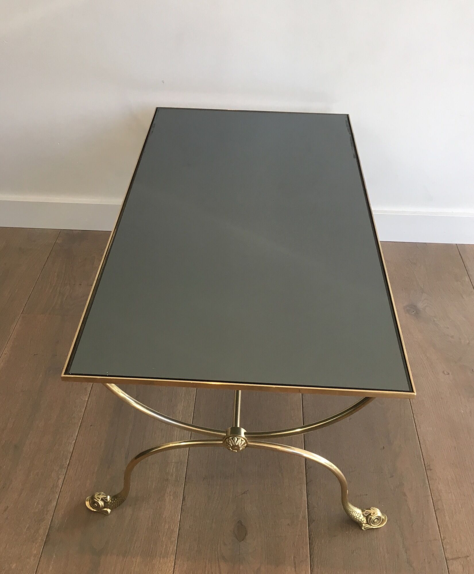 Neoclassical brass style coffee table with dolphin head decoration