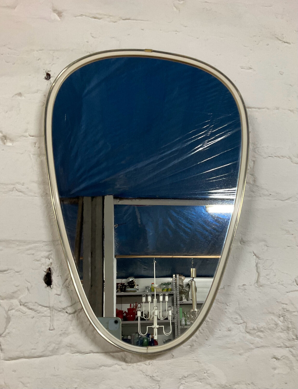 Asymmetrical free-form mirror from the 60s-70s