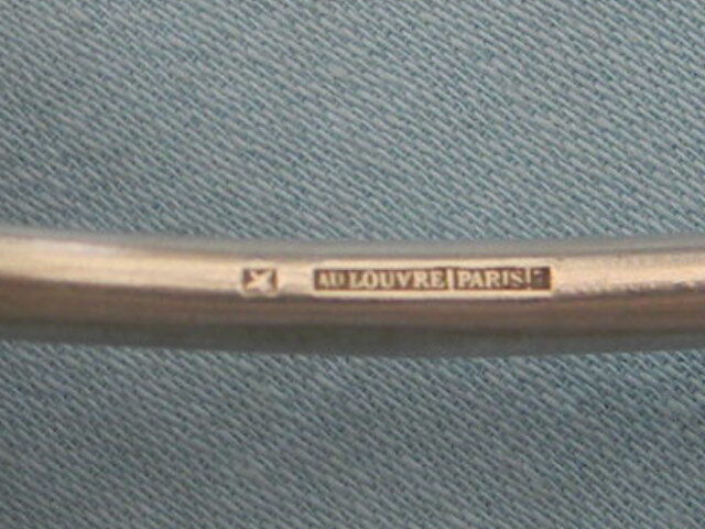 Set of 6 silver metal dessert spoons.