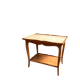 Coffee table, side table in light wood with saber legs.