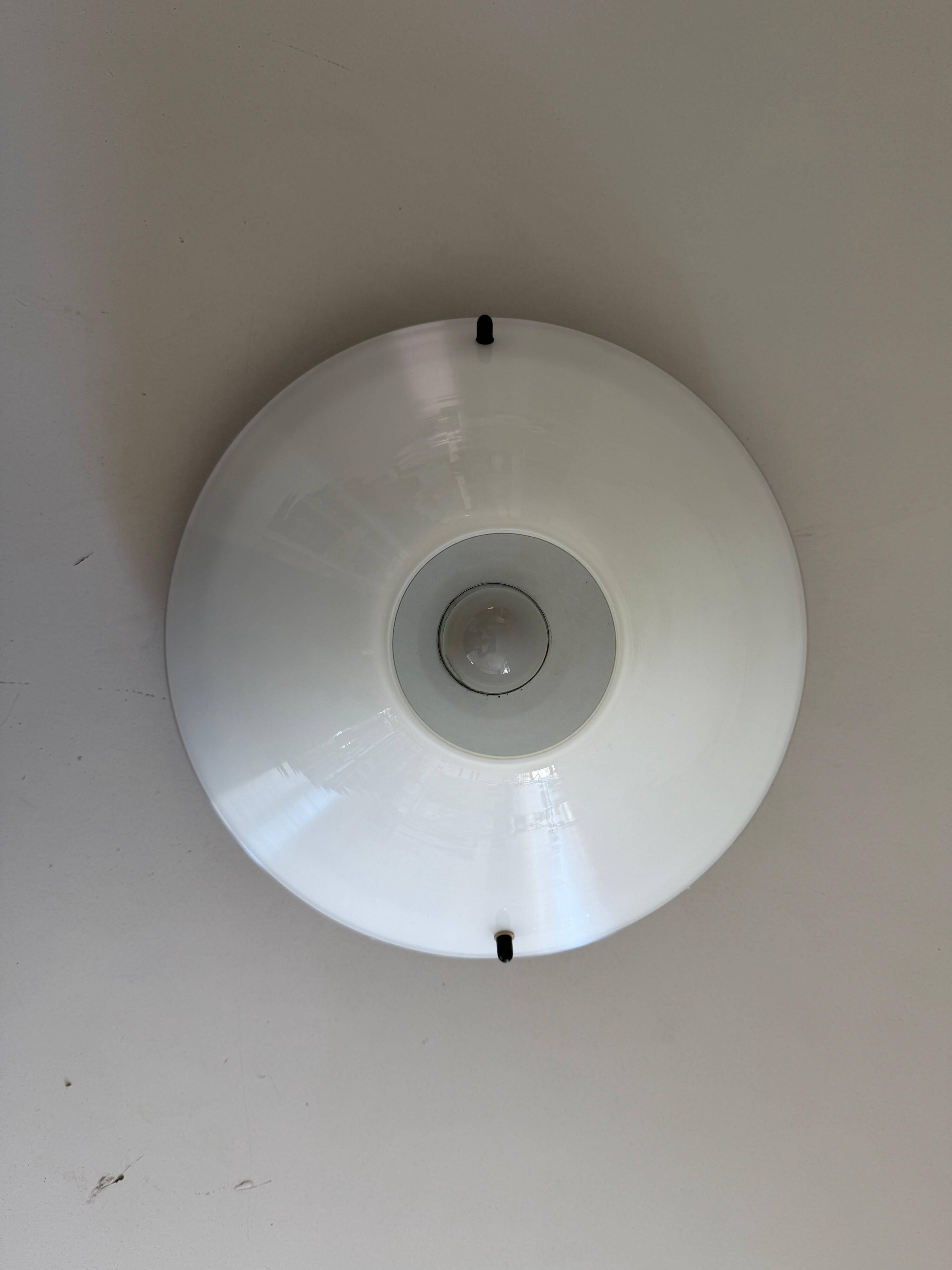 Simple opal glass wall light from the mid-century by Lamperti, 1960s, Italy.