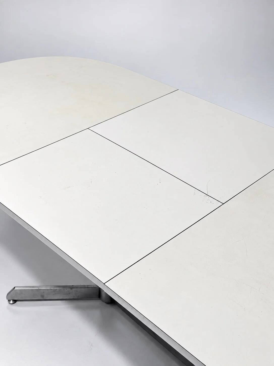 Vintage oval extendable dining table, white laminate and chrome, 1970s.
