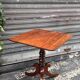 19th-century solid mahogany table with a tilting top and brass mechanism.