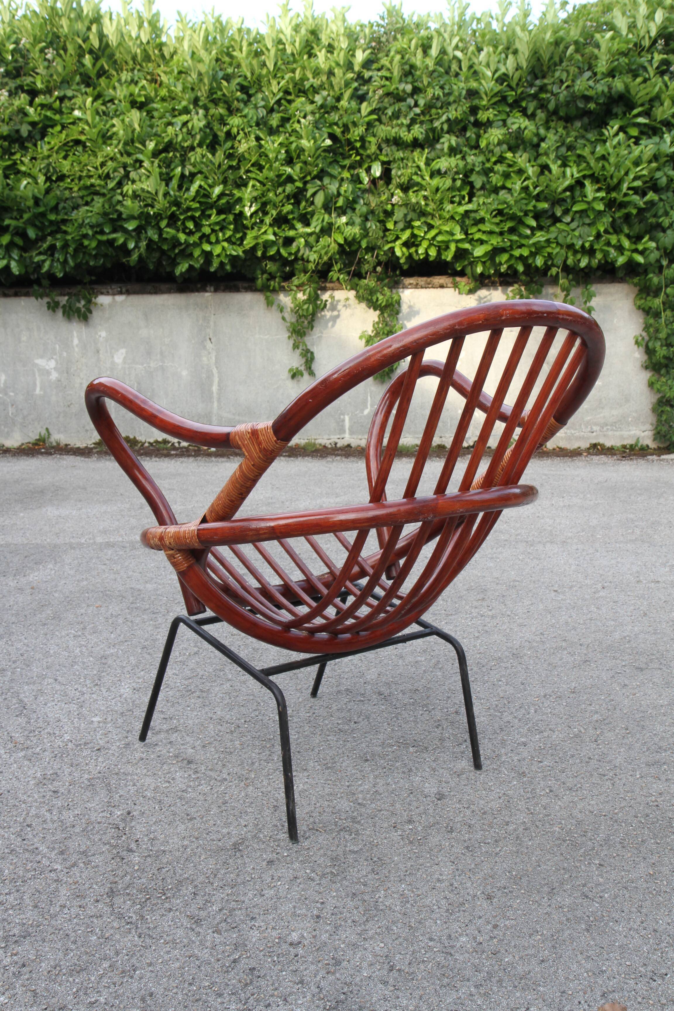 Rattan shell armchair with metal feet