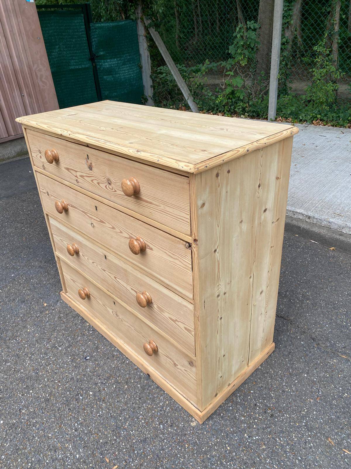 Victorian commode from the 19th century stripped to raw solid wood with ceramic knobs.