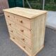 Victorian commode from the 19th century stripped to raw solid wood with ceramic knobs.