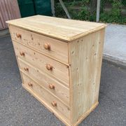 Victorian commode from the 19th century stripped to raw solid wood with ceramic knobs.