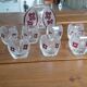 Vintage liqueur service in decorated red glass – decanter and 7 glasses