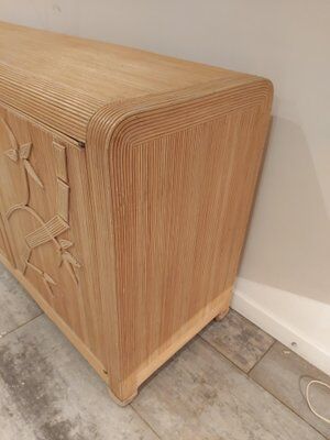 Vintage wicker sideboard with flowers