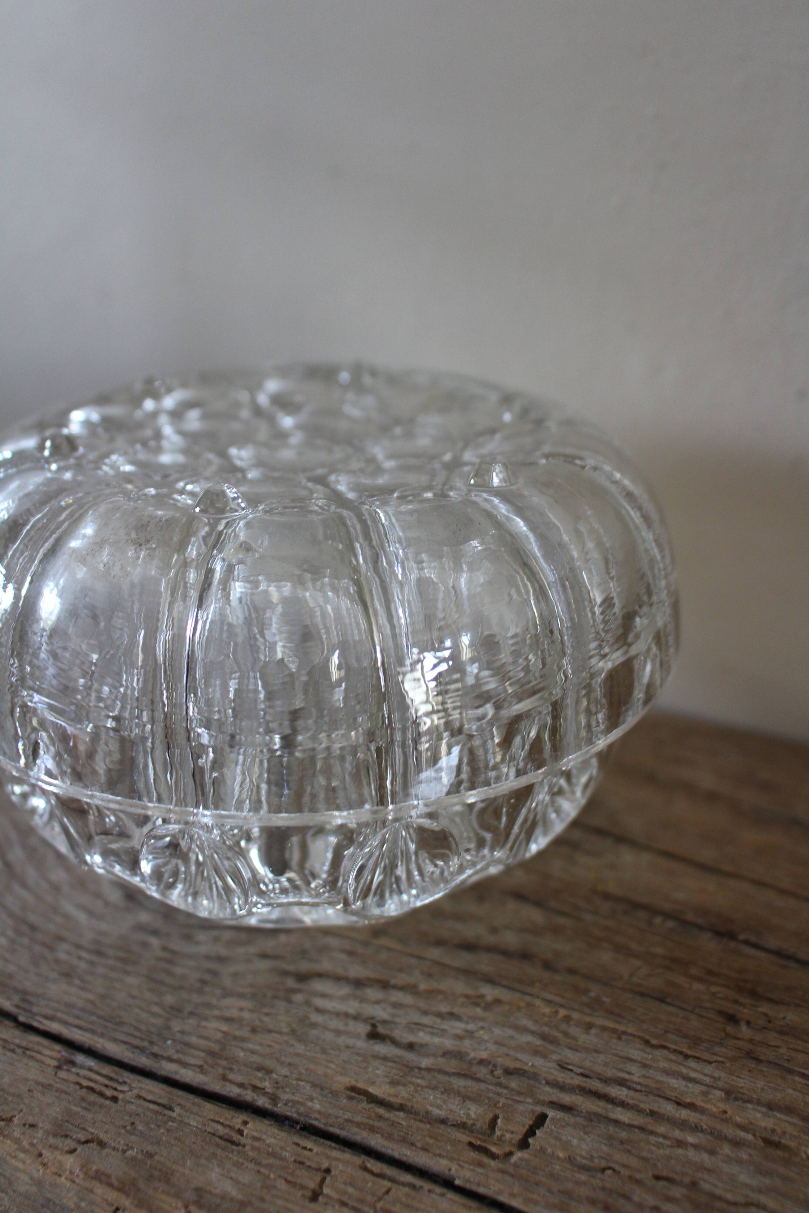Large round glass flower frog vase with 19 holes.