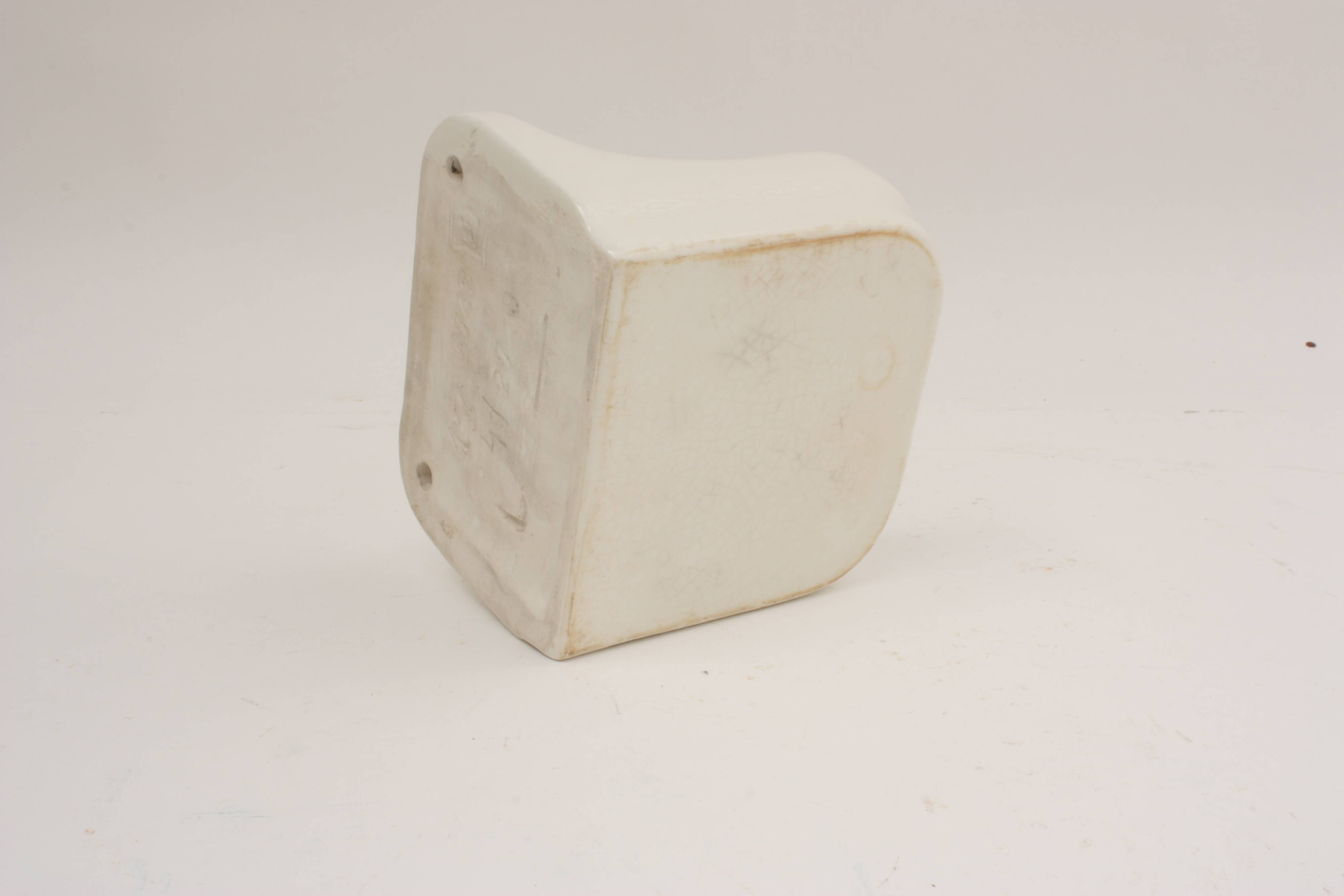 Wall-mounted earthenware soap dish