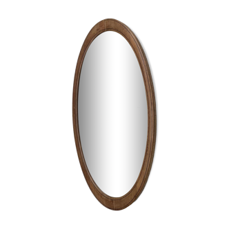 Miroir biseauté ovale entourée de bois clair dimension : hauteur -74,5cm- largeur -38,5cm- prof-2cm-