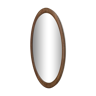 Miroir biseauté ovale entourée de bois clair dimension : hauteur -74,5cm- largeur -38,5cm- prof-2cm-