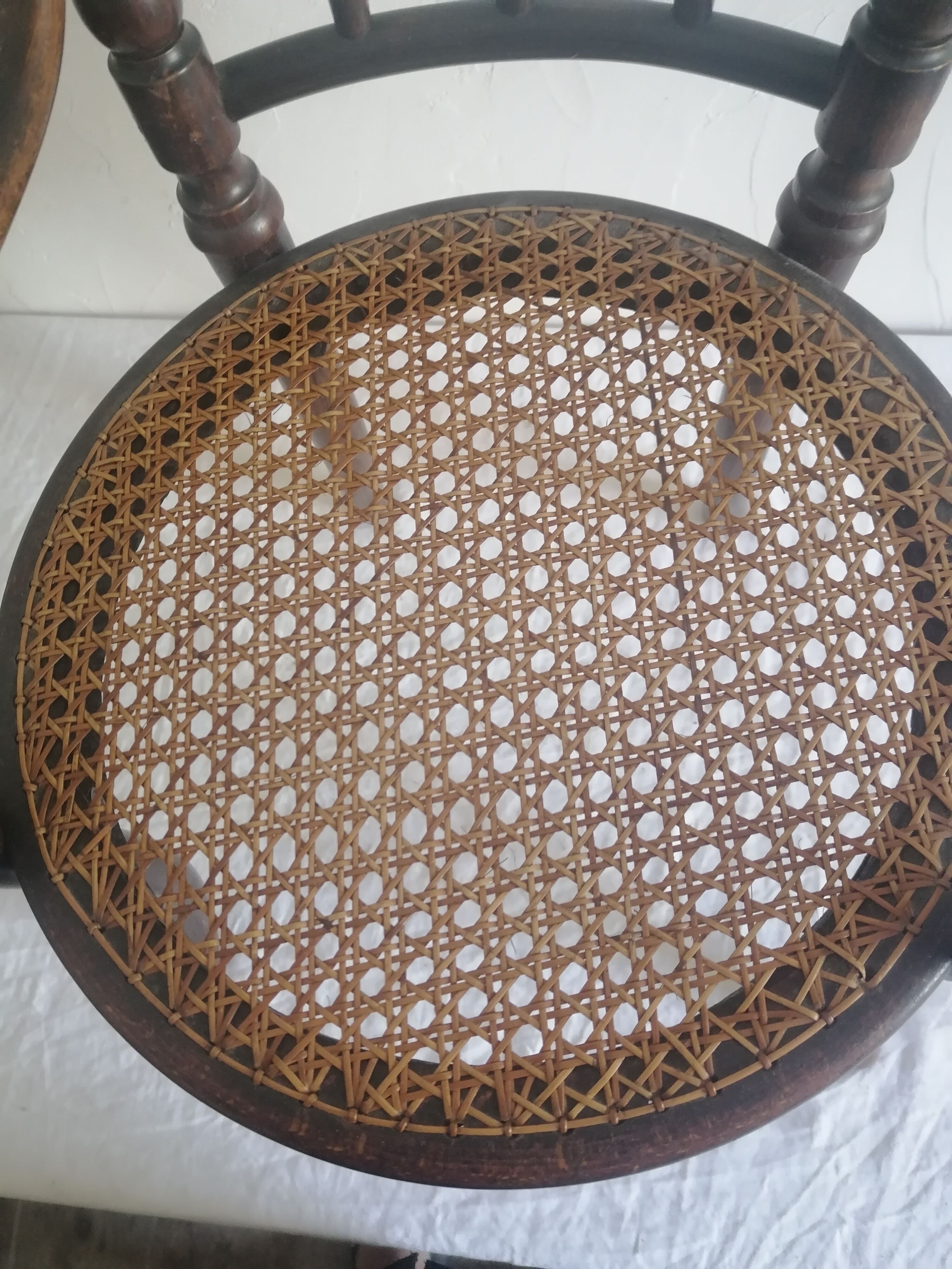 Old children's armchair in curved wood. Fischel