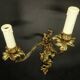 Pair of large Louis XV style wall lights - gilded bronze