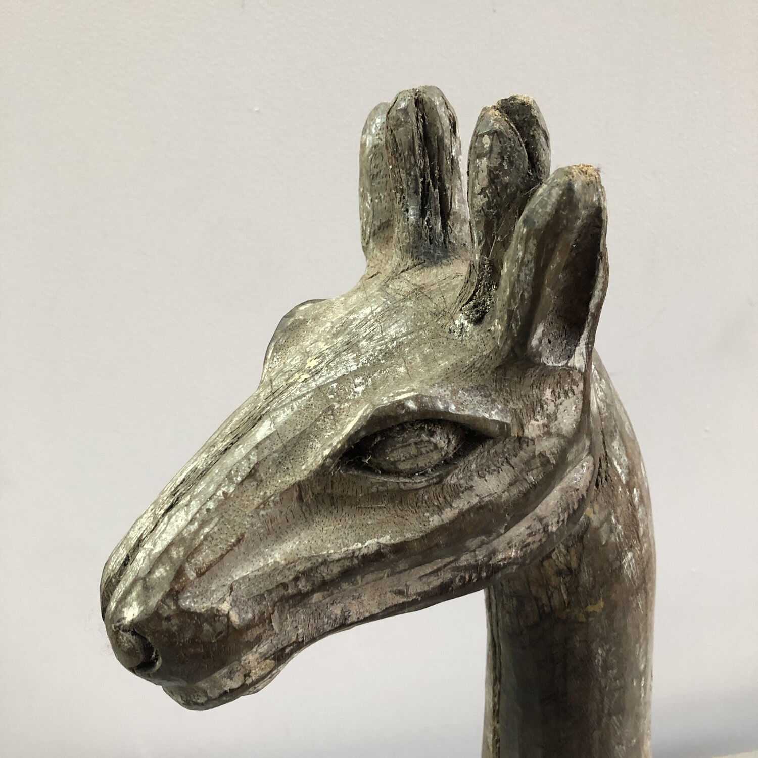 Wooden giraffe sculpture