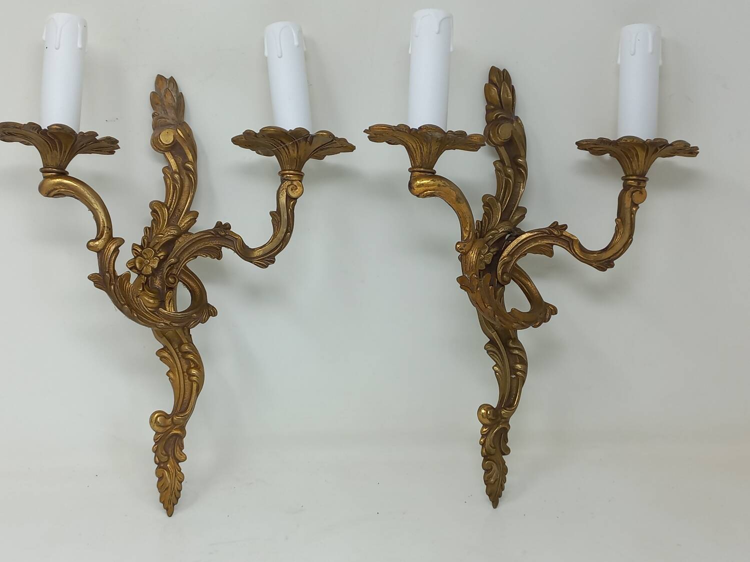 Pair of Louis XV style two-light bronze wall sconces