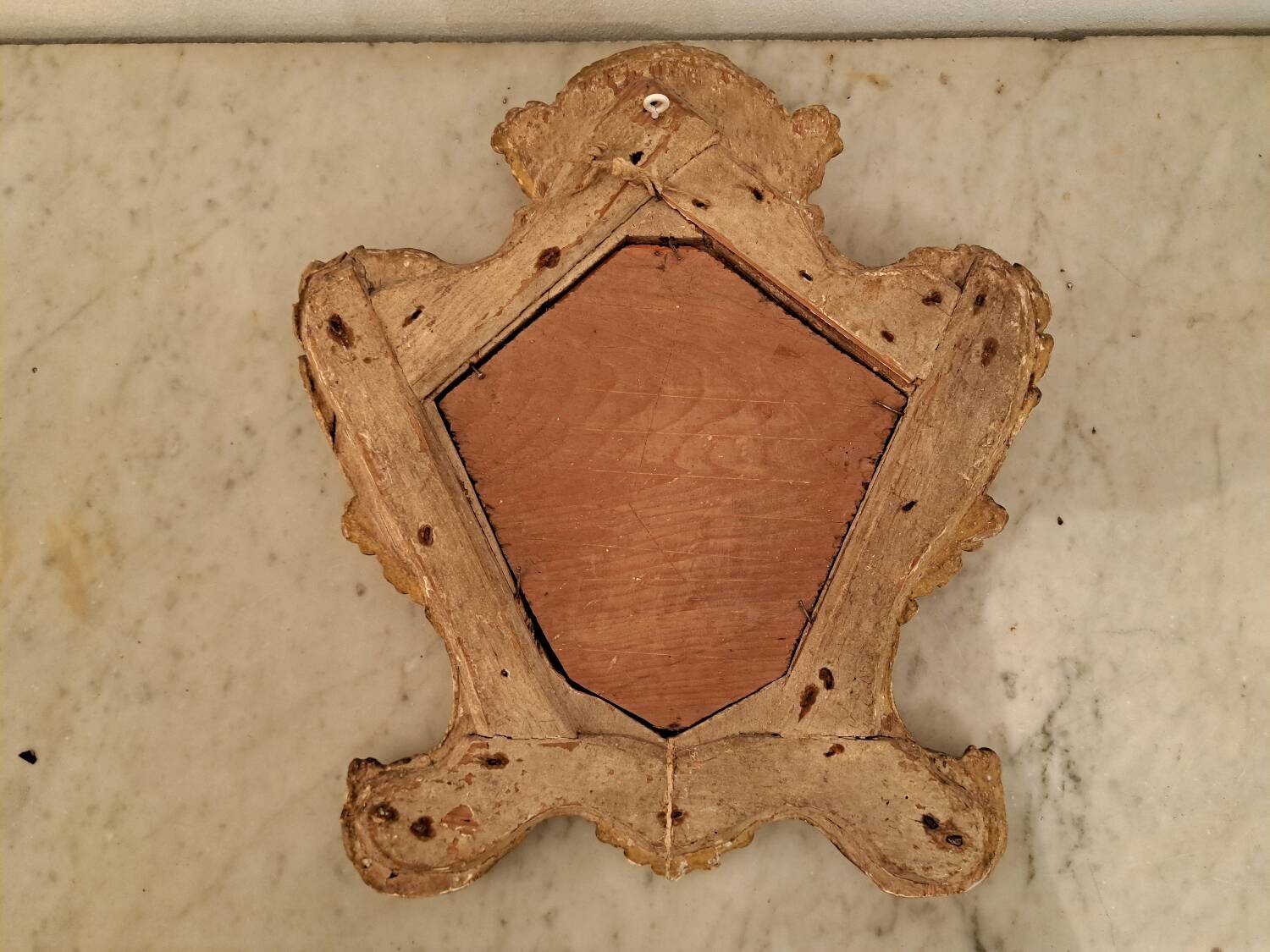 Eighteenth-century Venetian mirror in painted and gilded wood.
