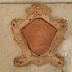 Eighteenth-century Venetian mirror in painted and gilded wood.