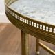 Brass coffee table with a vintage mirror top from the Baguès house.