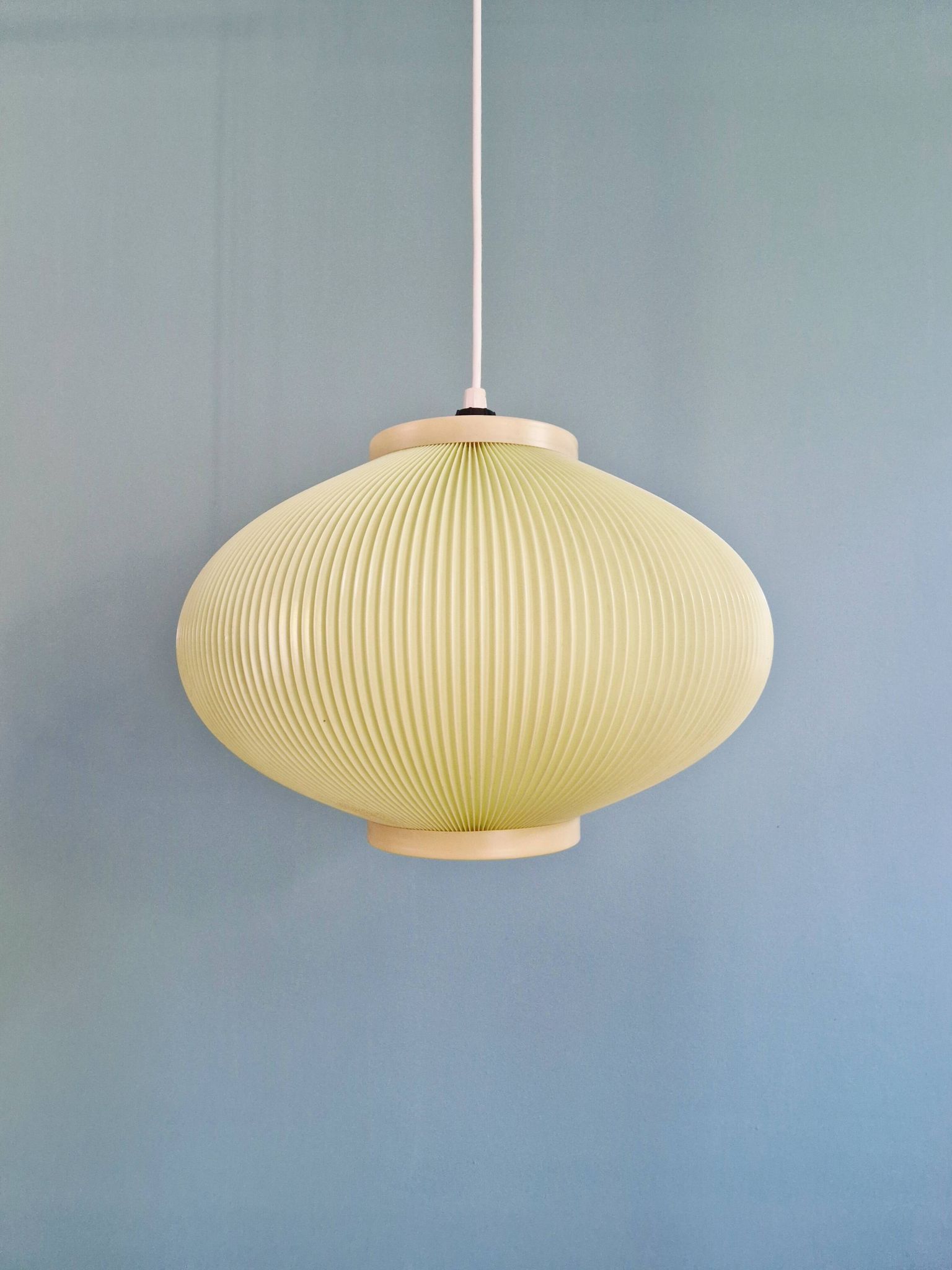 Vintage oval-shaped suspension in pleated celluloid, light green colour, 1960.