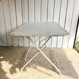 White folding metal bistro table