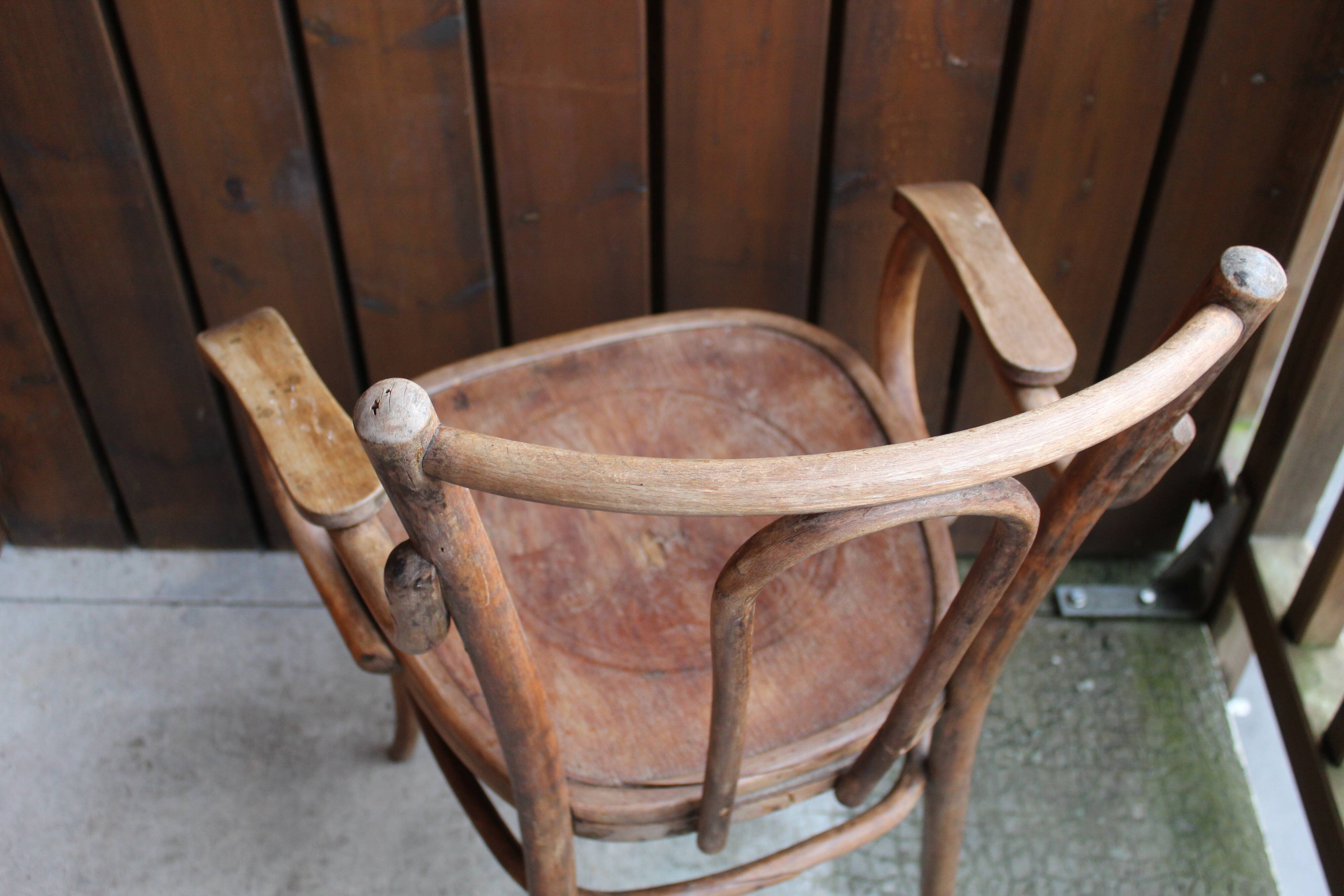 Curved wooden armchair