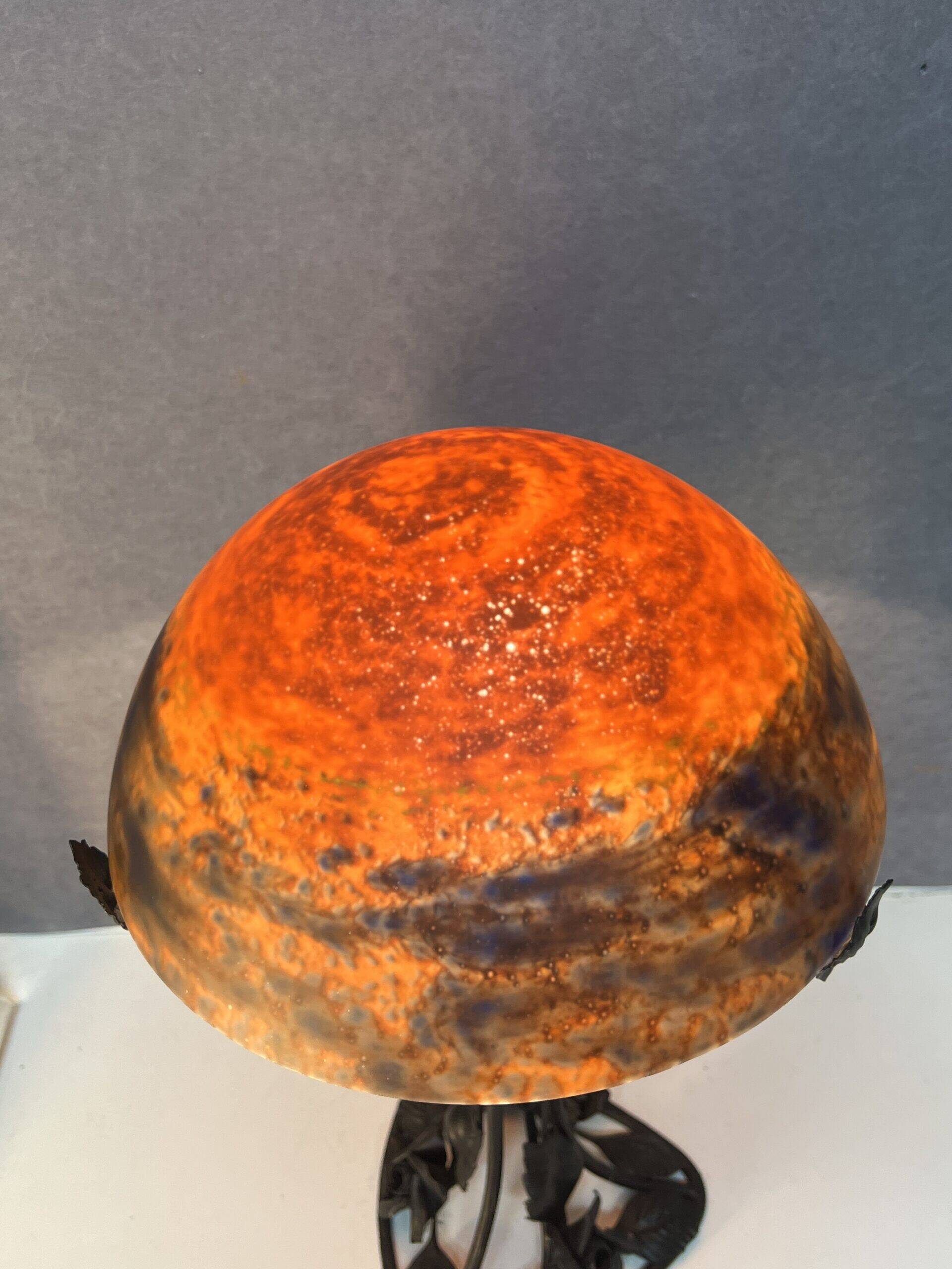 Contemporary mushroom lamp, wrought iron base and shaded orange glass shell