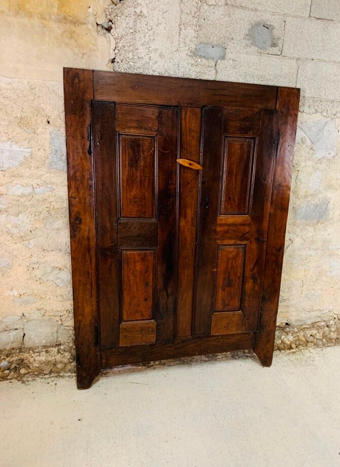 Old wooden doors of a Savoyard wardrobe chalet mountain vintage