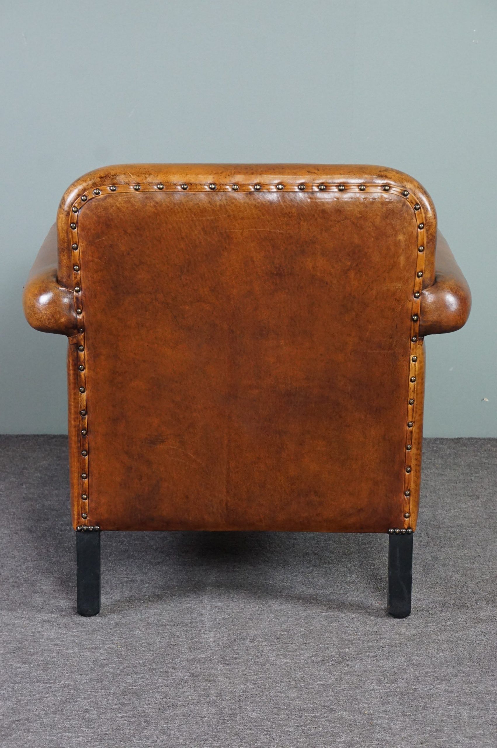 Schapenleren armchair and studio lounge stool