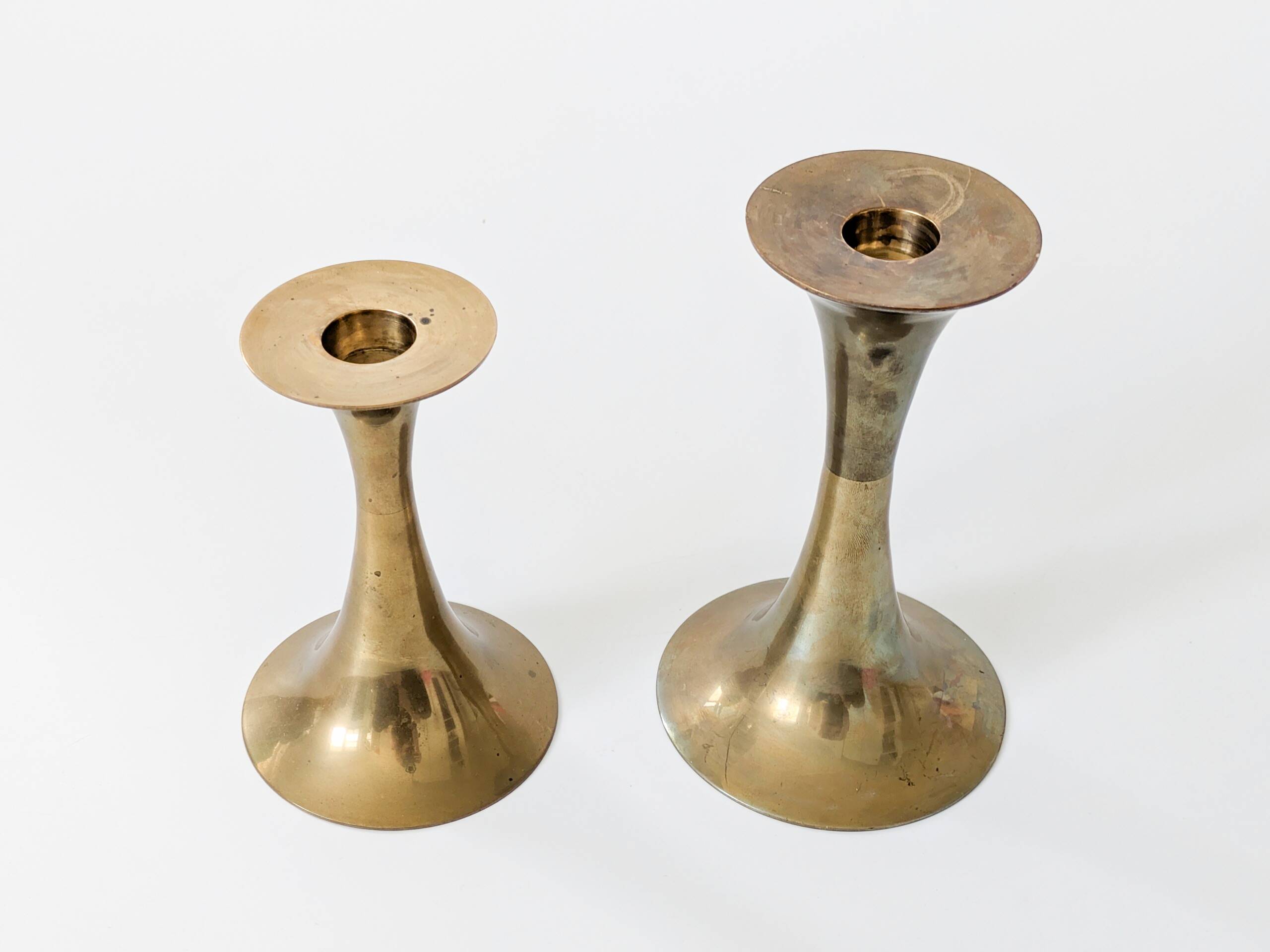 Pair of Midcentury brass candlesticks, flared shape.