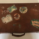 Suitcase of leather with labels of palaces