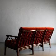 Dark rattan 3-seater sofa with red velour cushions | 1980s