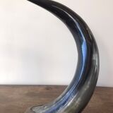 Polished beef horn on brass base