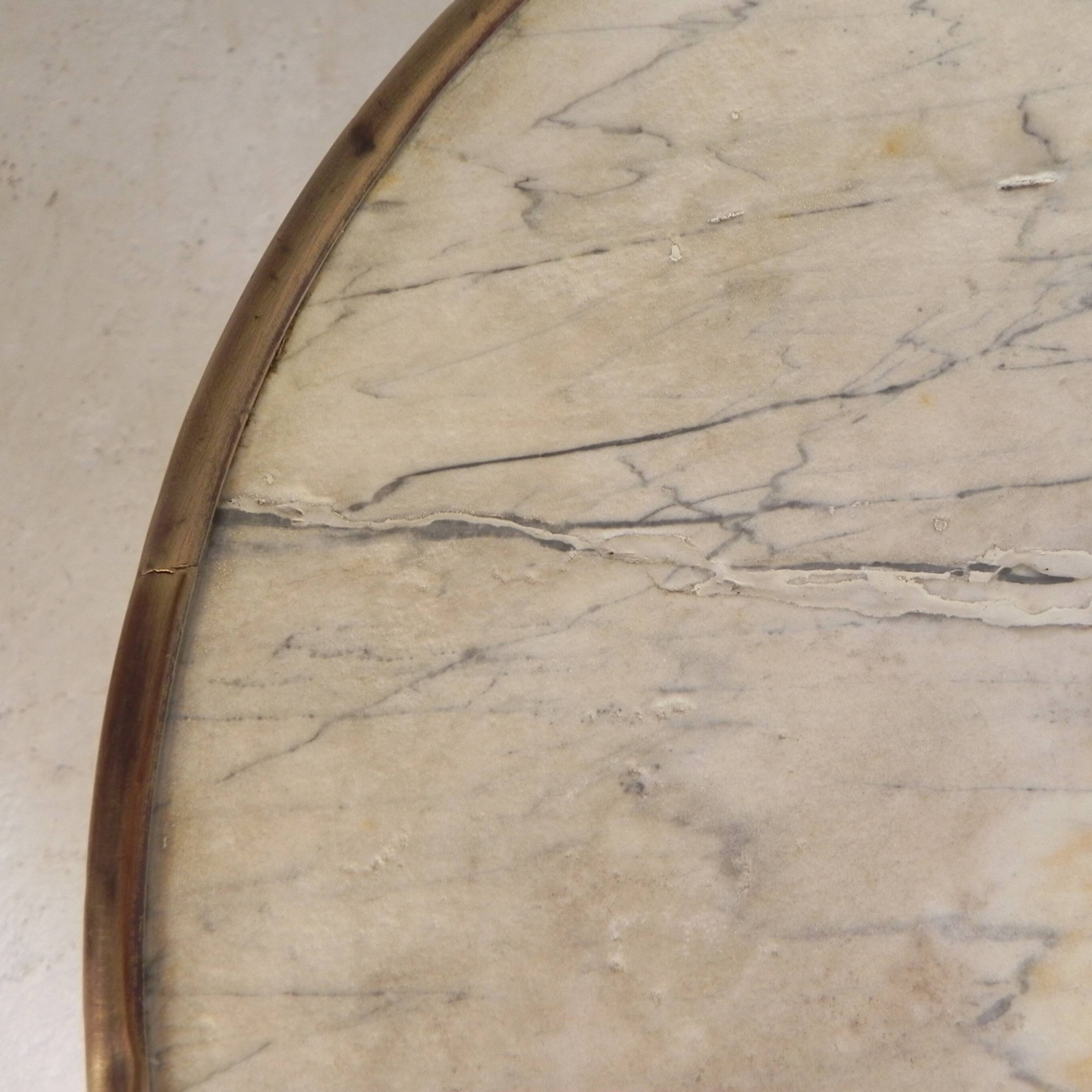Bistro table with a marble top and brass edging, early 20th century.