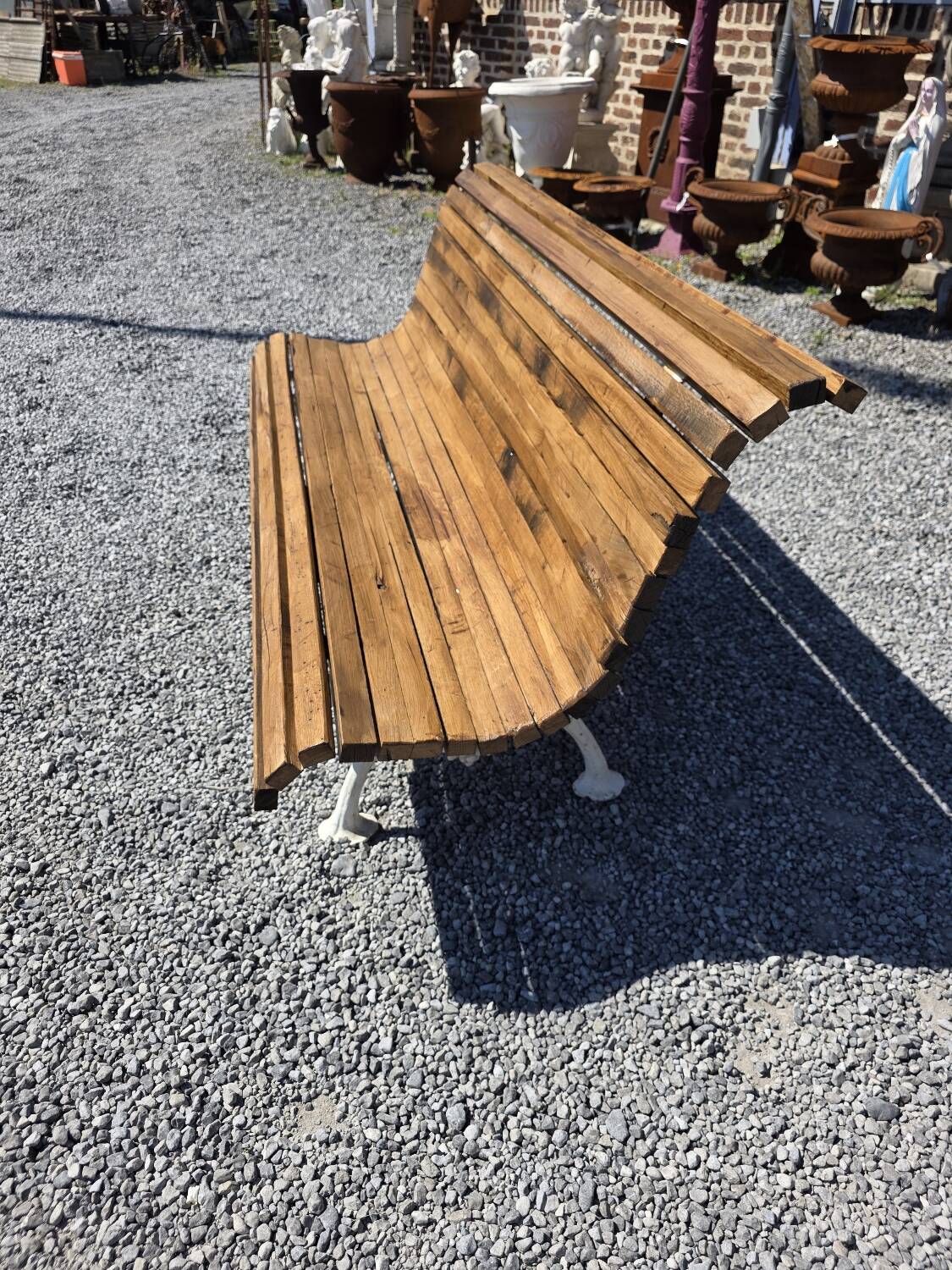 Antique garden bench made of cast iron and oak slats
