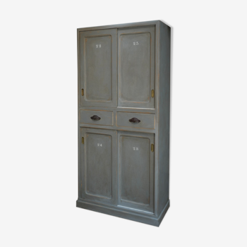 Grey patinated fir cabinet has 4 sliding doors and 2 tioirs